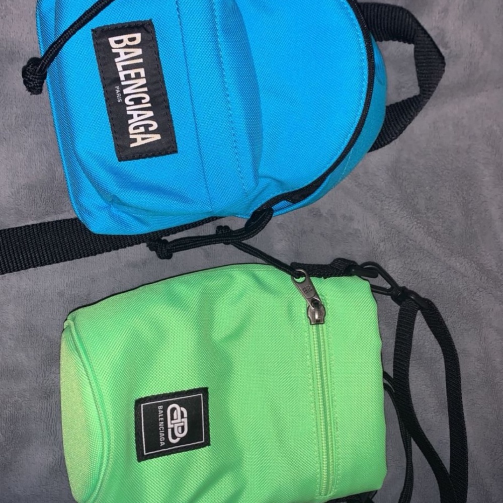 Two Balenciaga explorer bags.